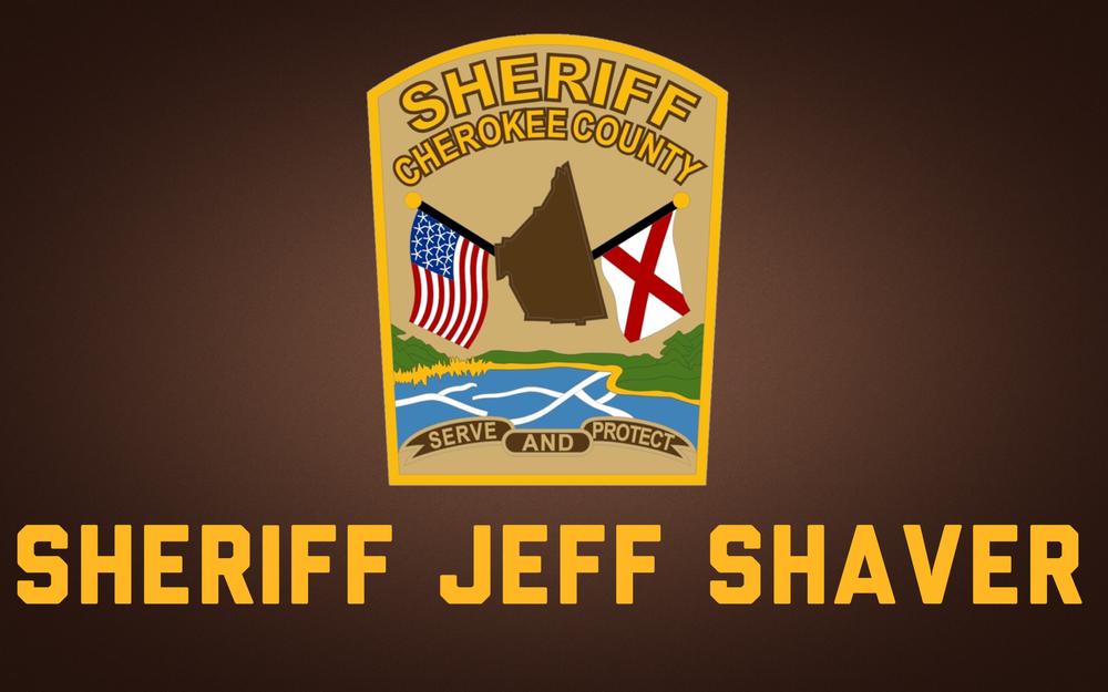 brown background with Cherokee County Sheriff patch and Sheriff Jeff Shaver text in gold
