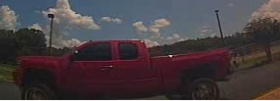 Red 2011 Chevrolet Silverado with license plate number 11FR476 left side