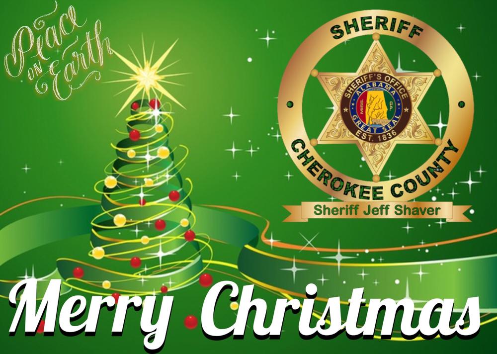Green and gold back ground with peace on earth in gold, Merry Christmas in white and the Sheriff of Cherokee County badge