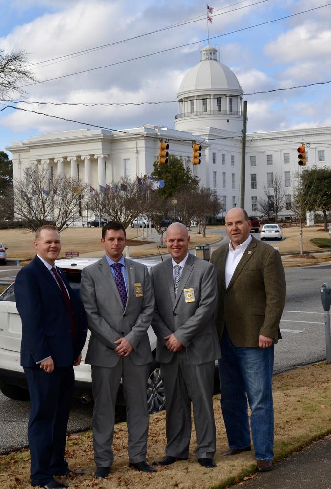 Chief Investigator Josh Summerford and Investigator Jeremy Stepps with other members of the ALEA standing in front of the capital building