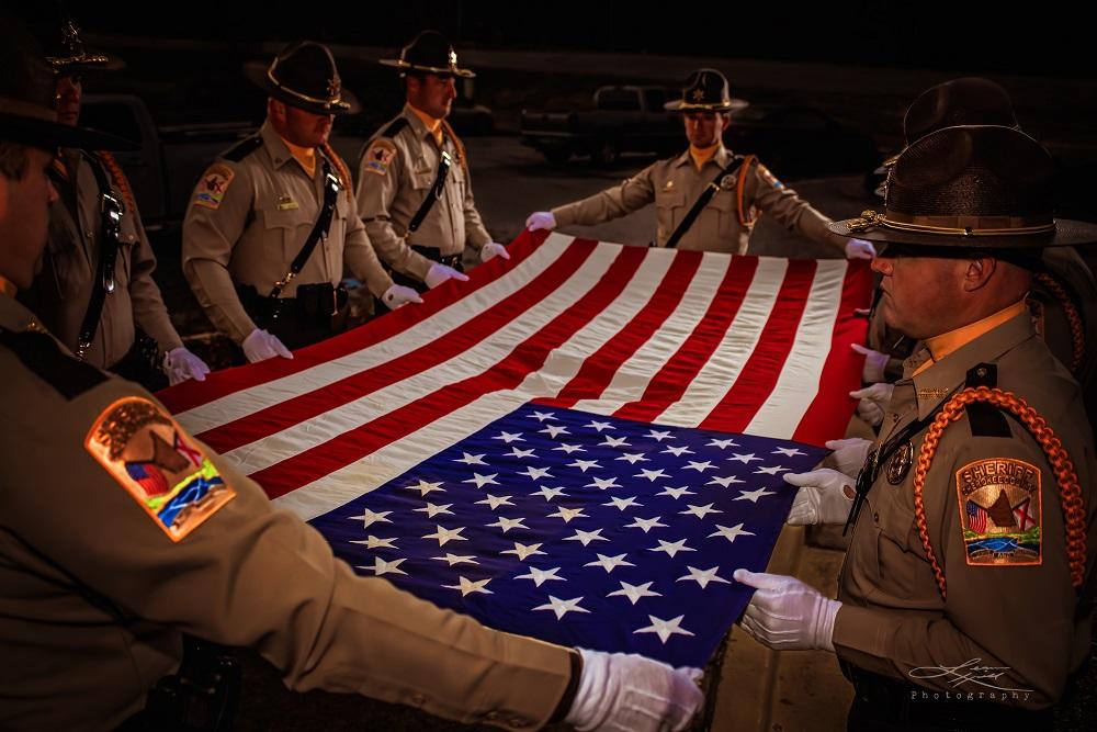 Cherokee County Sheriff's Office Honor Guard preparing to fold the American flag