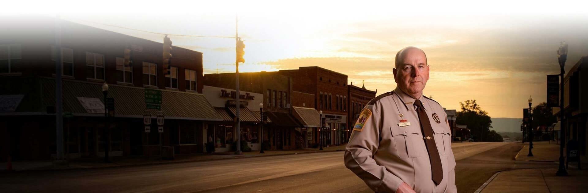 The Sheriffs standing before historic downtown.