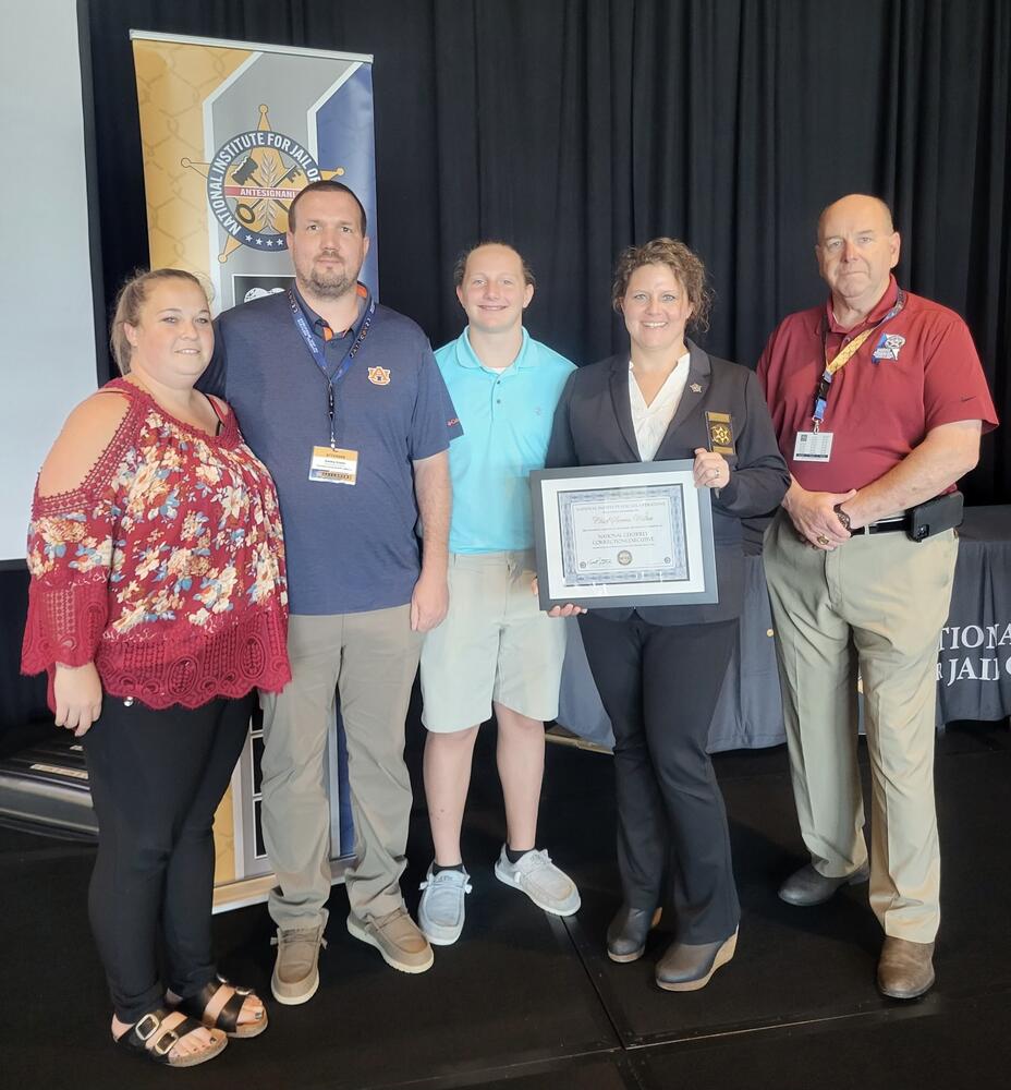 Jessy Green (wife of Jimmy), Sgt. Jimmy Green, Wesley Messer (son of Wilks), Chief of Corrections Sierra Wilks, and Sheriff Shaver